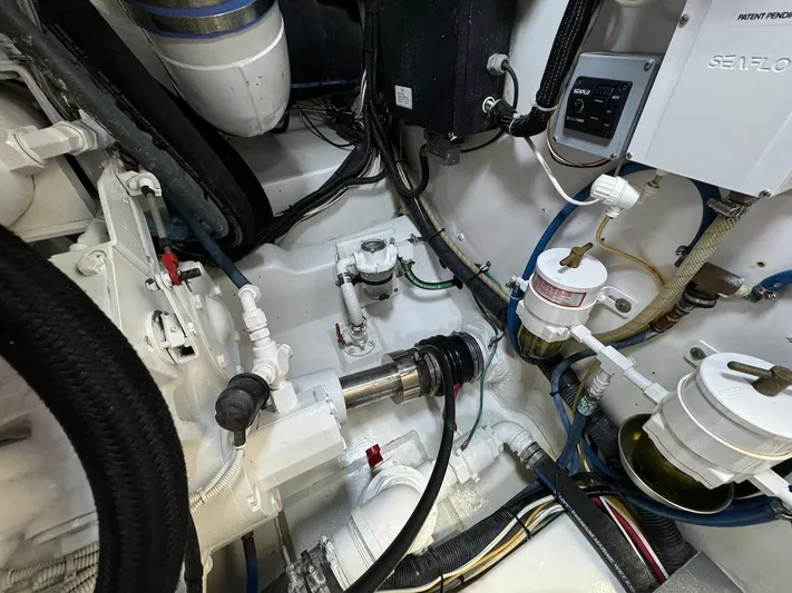  Yacht Photos Pics Engine room of a 2004 Bertram 510 Convertible yacht, showcasing mechanical components.