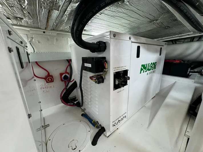  Yacht Photos Pics Engine room of 2004 Bertram 510 Convertible with a Phasor Marine generator.