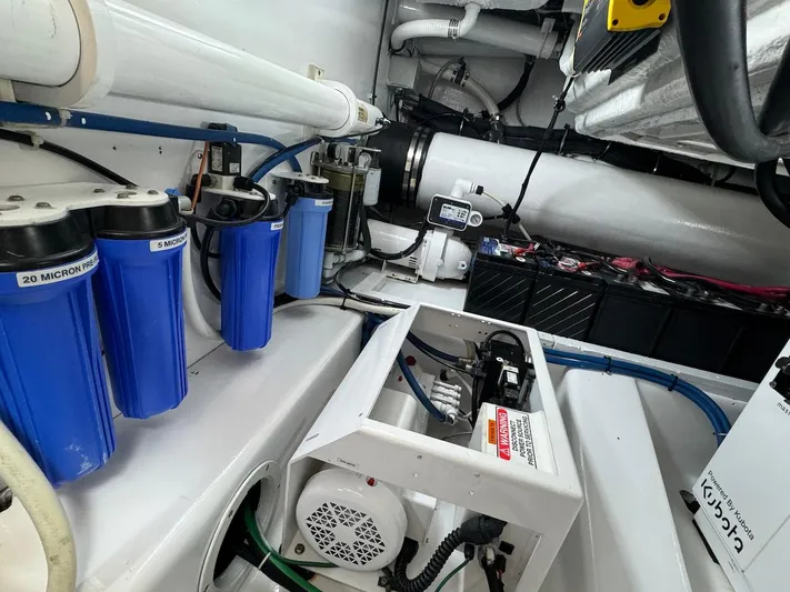  Yacht Photos Pics Engine room of 2004 Bertram 510 Convertible with filtration system and equipment.