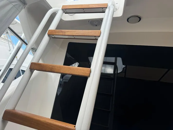  Yacht Photos Pics Ladder on 2004 Bertram 510 Convertible yacht with wooden steps.