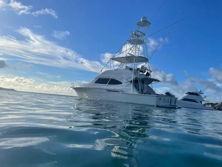  Yacht Photos Pics 2004 Bertram 510 Convertible yacht on calm ocean waters under blue sky.