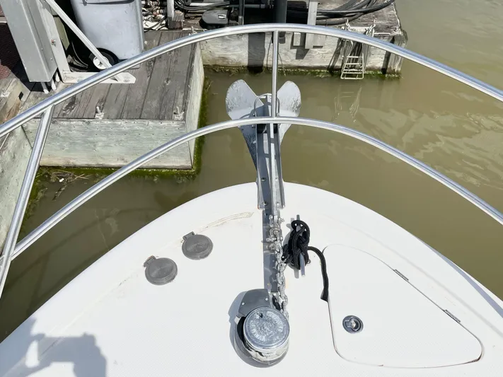  Yacht Photos Pics Bow view of 2003 Meridian 341 Sedan yacht with anchor and railing.