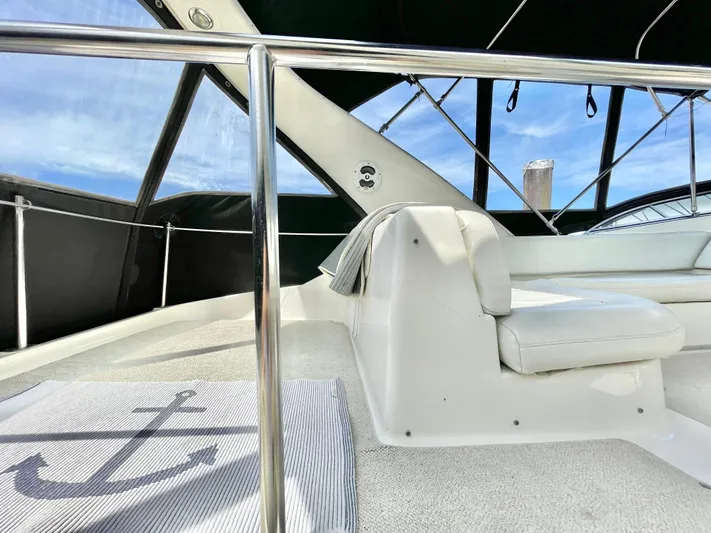  Yacht Photos Pics 2003 Meridian 341 Sedan interior with white seating and nautical-themed decor.