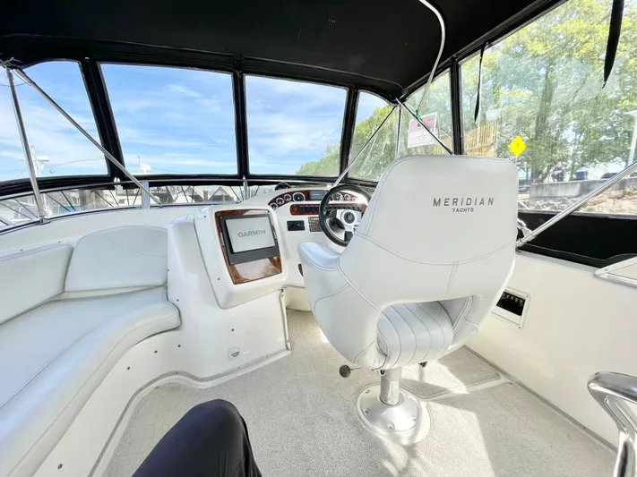 Yacht Photos Pics Interior of 2003 Meridian 341 Sedan yacht with helm and seating area.