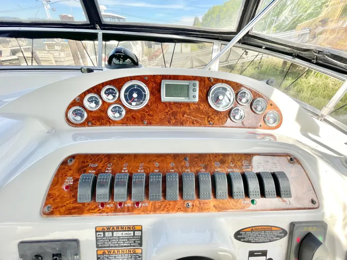  Yacht Photos Pics Control panel of a 2003 Meridian 341 Sedan boat with gauges and switches.