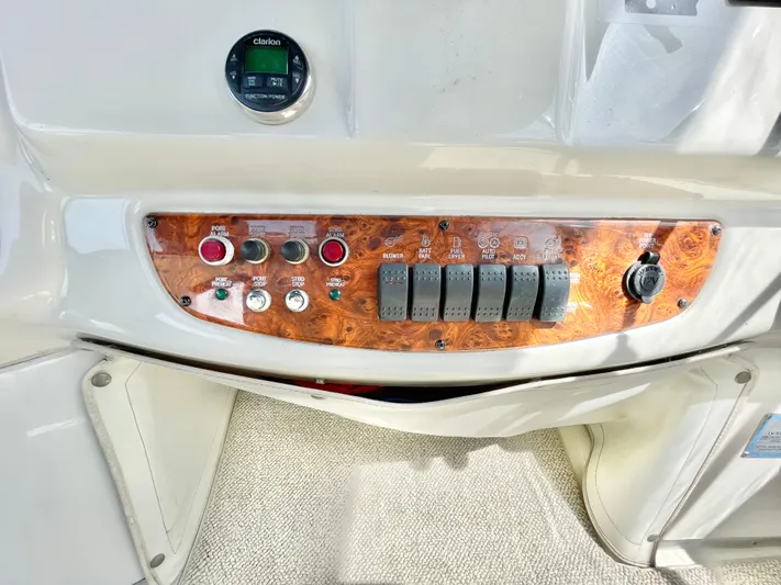 Yacht Photos Pics Control panel of a 2003 Meridian 341 Sedan boat with wood finish and switches.