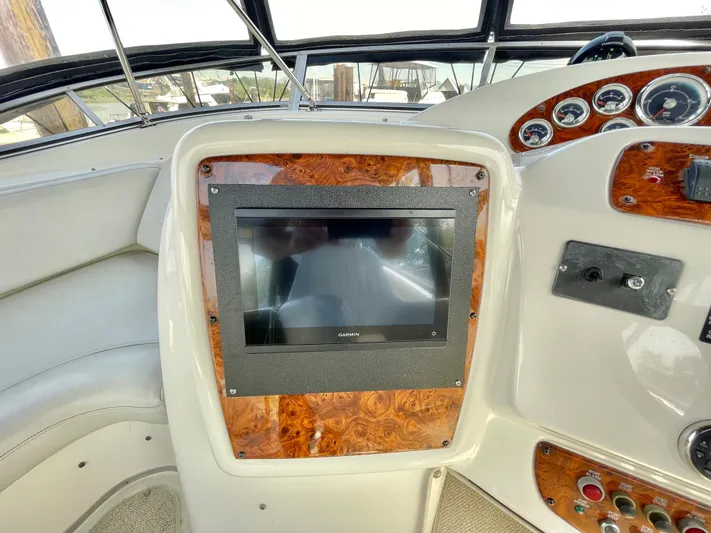  Yacht Photos Pics Dashboard of 2003 Meridian 341 Sedan with wood accents and navigation screen.
