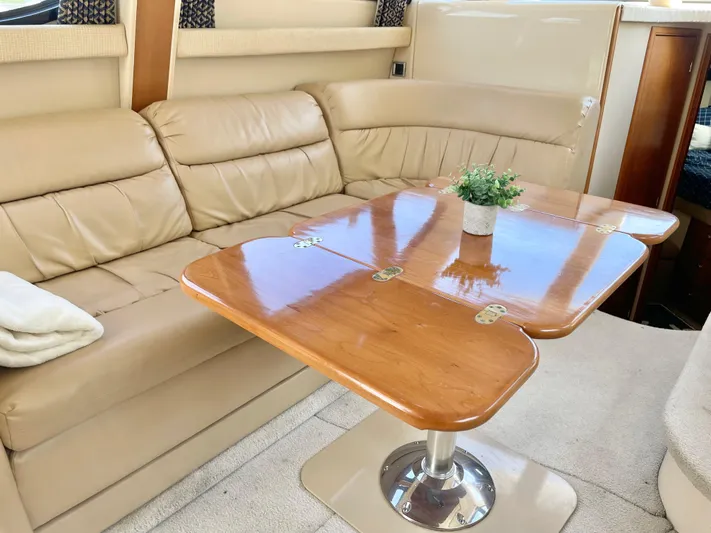  Yacht Photos Pics Luxurious interior of 2003 Meridian 341 Sedan with leather seating and wooden table.