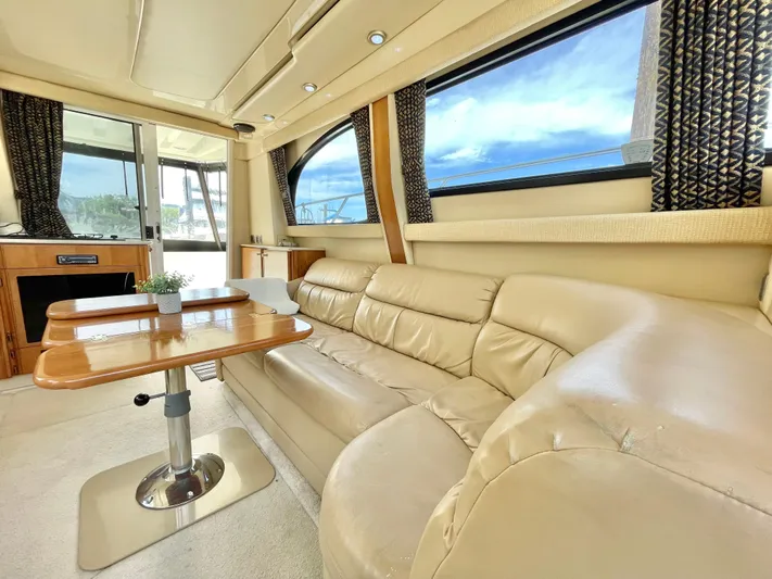  Yacht Photos Pics Luxurious interior of a 2003 Meridian 341 Sedan yacht with beige leather seating.