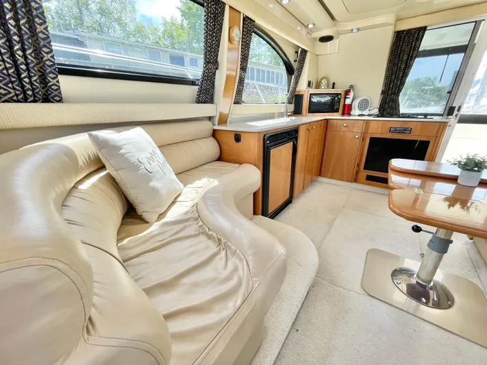  Yacht Photos Pics Luxurious interior of a 2003 Meridian 341 Sedan yacht with plush seating and modern amenities.