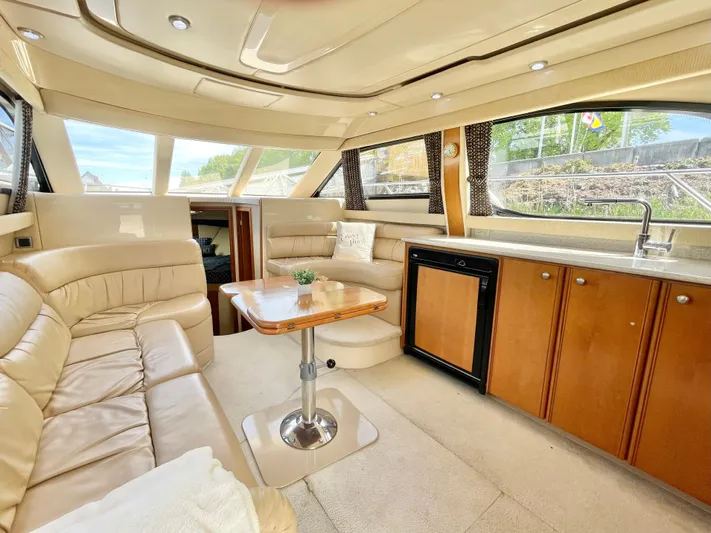  Yacht Photos Pics Luxurious interior of a 2003 Meridian 341 Sedan yacht with plush seating and modern amenities.