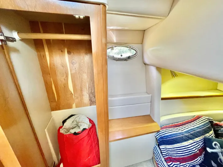  Yacht Photos Pics Interior of 2003 Meridian 341 Sedan with wooden closet and cozy seating area.