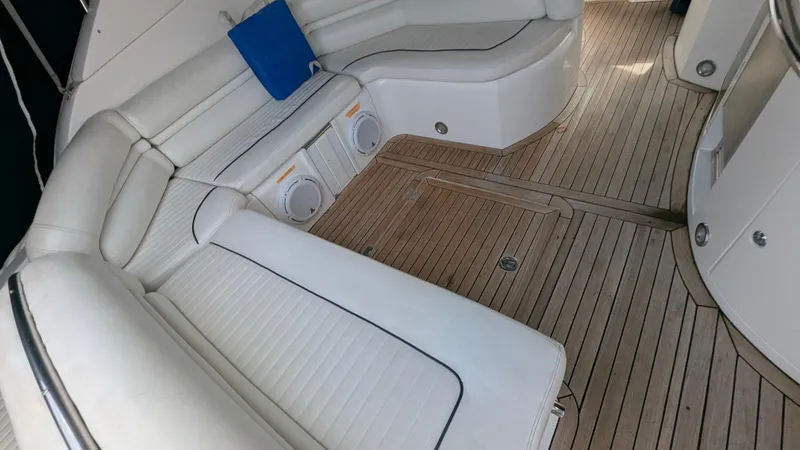 Cavallo Yacht Photos Pics Luxurious 2004 Sunseeker Portofino yacht interior with white seating and wooden flooring.