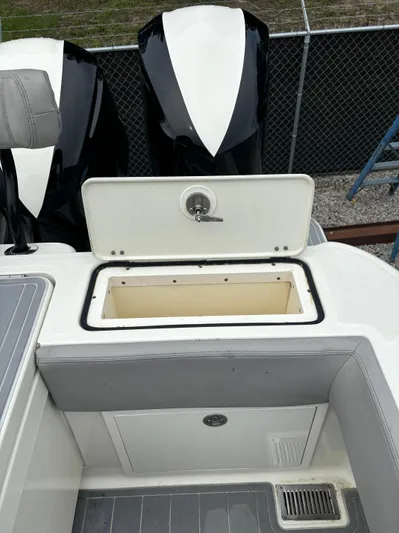  Yacht Photos Pics 2017 HCB Speciale boat with open storage compartment and dual outboard motors.