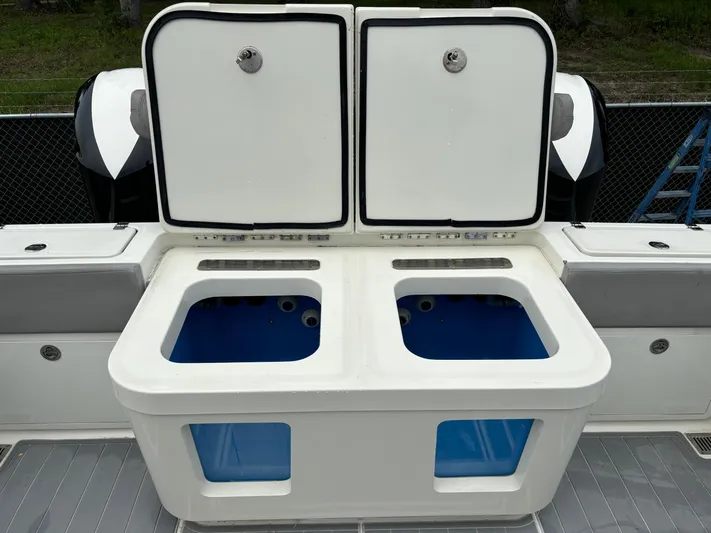  Yacht Photos Pics 2017 HCB Speciale boat with dual livewells open on deck.