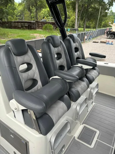  Yacht Photos Pics Luxury seating on 2017 HCB Speciale boat, featuring sleek black and gray design.