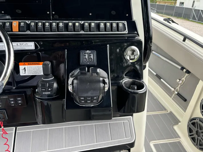  Yacht Photos Pics Control panel of 2017 HCB Speciale boat with switches and throttle.