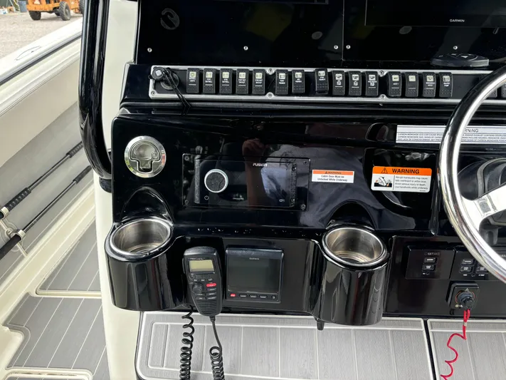  Yacht Photos Pics 2017 HCB Speciale boat dashboard with controls and cup holders.