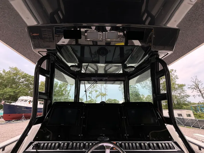  Yacht Photos Pics 2017 HCB Speciale boat cockpit with advanced navigation controls and panoramic view.