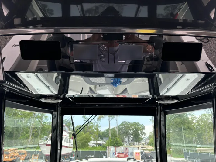  Yacht Photos Pics Interior view of 2017 HCB Speciale boat cockpit with navigation equipment.