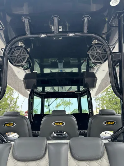  Yacht Photos Pics 2017 HCB Speciale boat interior with black seating and speaker system.