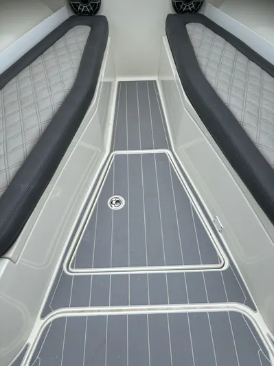  Yacht Photos Pics 2017 HCB Speciale boat interior with gray cushioned seating and sleek flooring.