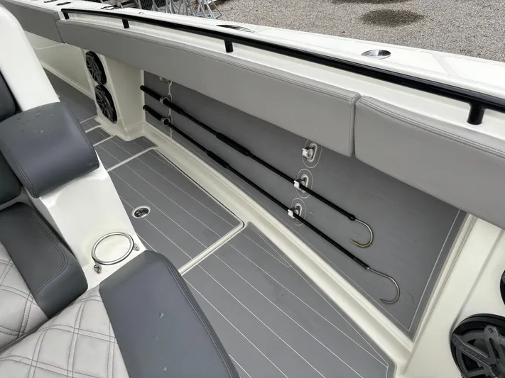  Yacht Photos Pics 2017 HCB Speciale boat interior with rod holders and cushioned seating.