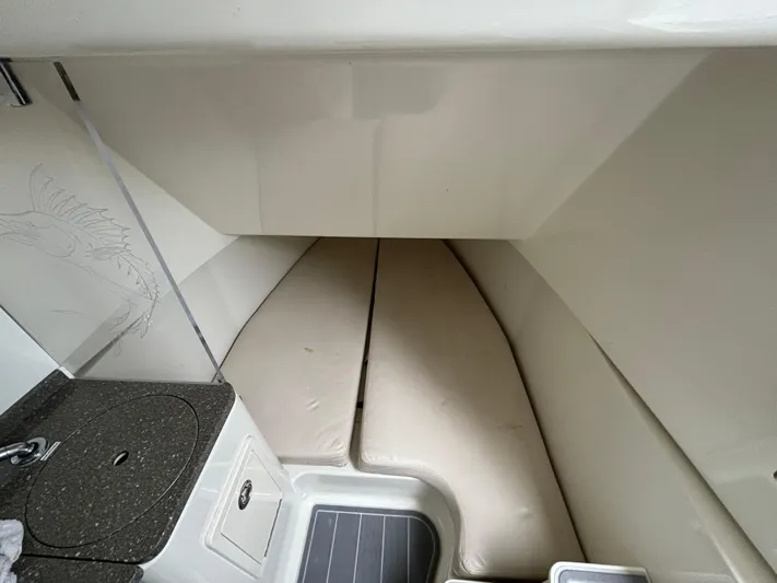  Yacht Photos Pics 2017 HCB Speciale cabin interior with cushioned seating and compact kitchenette.