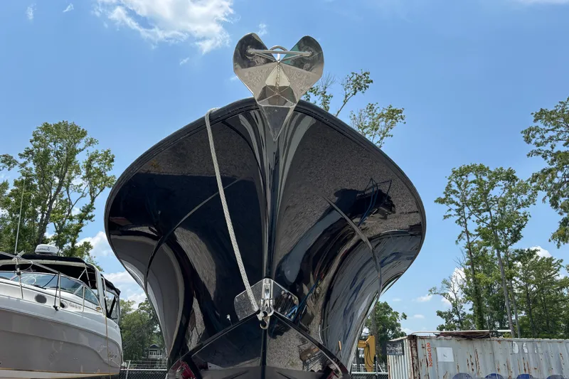  Yacht Photos Pics Front view of a 2017 HCB Speciale boat with a shiny black hull.