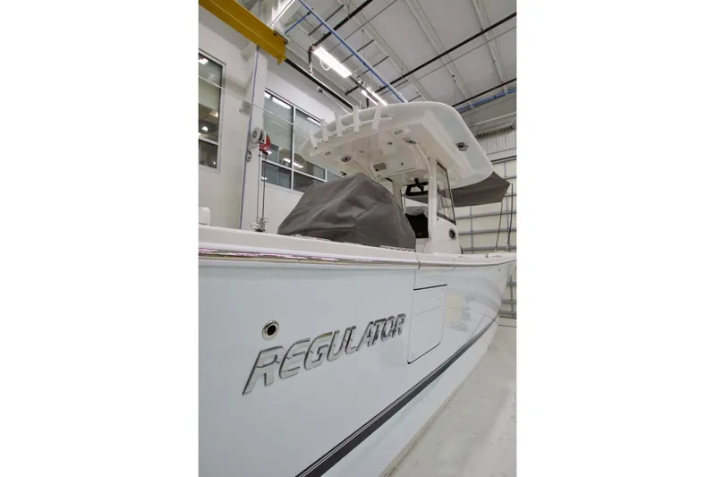 31-406 Yacht Photos Pics 2026 Regulator 31 boat in a showroom, showcasing sleek design and modern features.