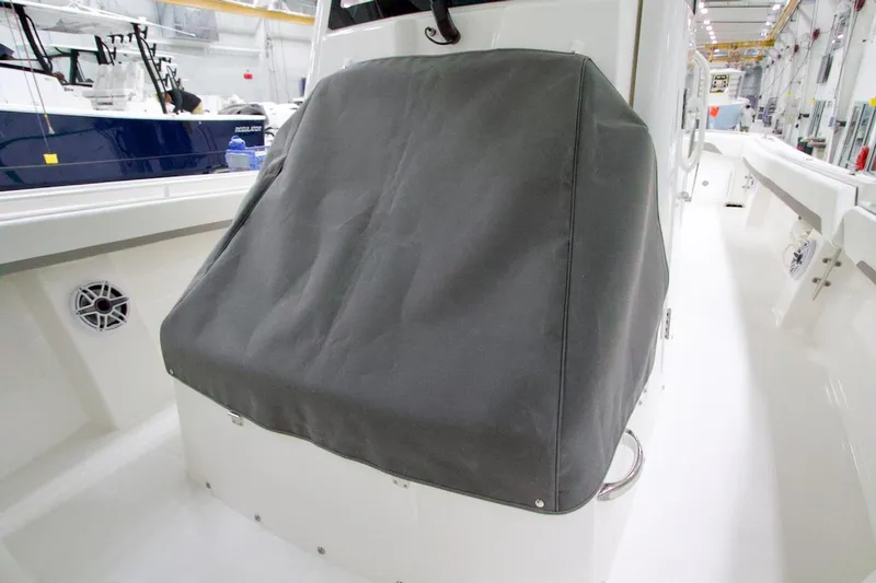 31-406 Yacht Photos Pics 2026 Regulator 31 boat console covered in a protective gray fabric.