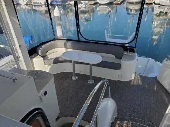 Embracing Life Yacht Photos Pics 2004 Meridian 459 Motoryacht interior with seating area and marina view.