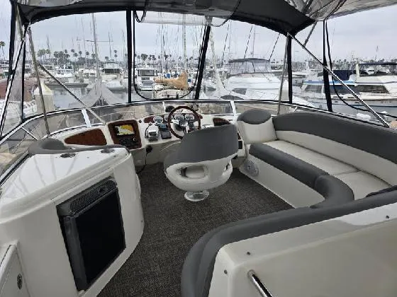 Embracing Life Yacht Photos Pics 2004 Meridian 459 Motoryacht interior with helm, seating, and marina view.