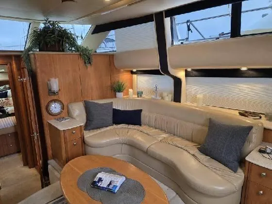 Embracing Life Yacht Photos Pics Luxurious interior of 2004 Meridian 459 Motoryacht with plush seating and elegant decor.