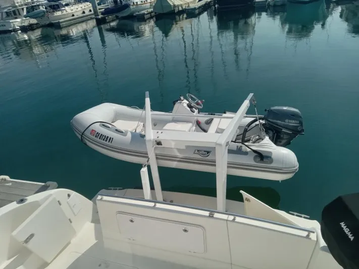 Embracing Life Yacht Photos Pics Inflatable dinghy with Yamaha motor on 2004 Meridian 459 Motoryacht, docked at marina.