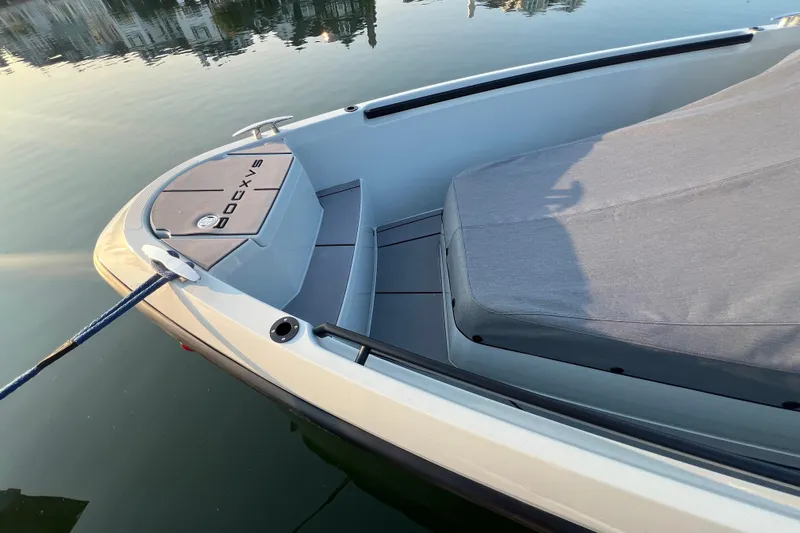  Yacht Photos Pics 2023 Saxdor 320 GTO boat bow with sleek design and covered seating area.