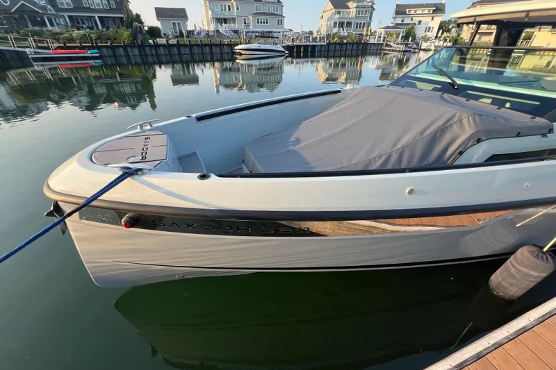  Yacht Photos Pics 2023 Saxdor 320 GTO boat docked in a serene marina setting.