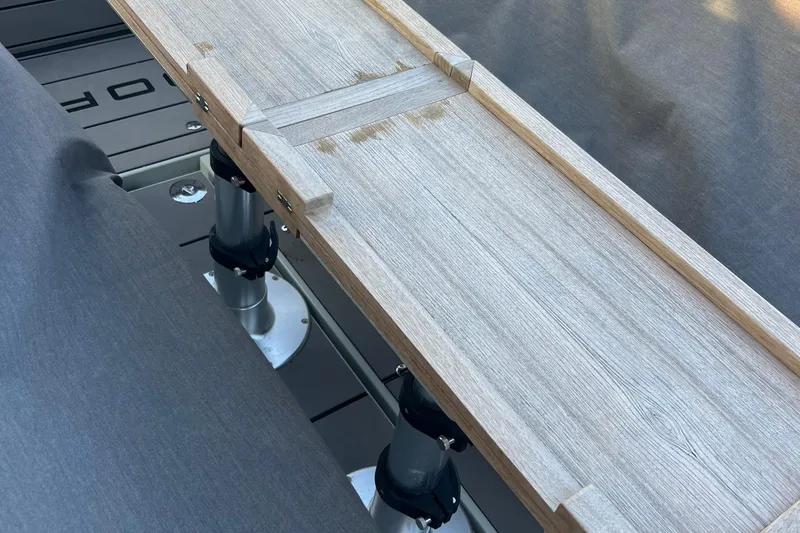  Yacht Photos Pics 2023 Saxdor 320 GTO interior with wooden table and gray seating.