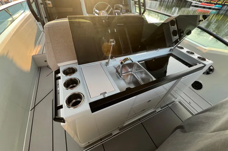 Yacht Photos Pics 2023 Saxdor 320 GTO boat interior with modern kitchenette and sink.
