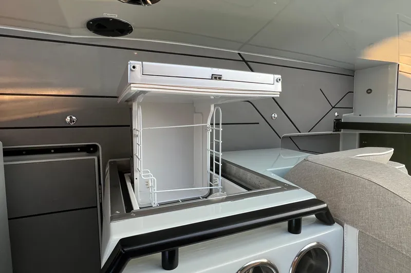  Yacht Photos Pics 2023 Saxdor 320 GTO interior with open storage compartment and modern design.