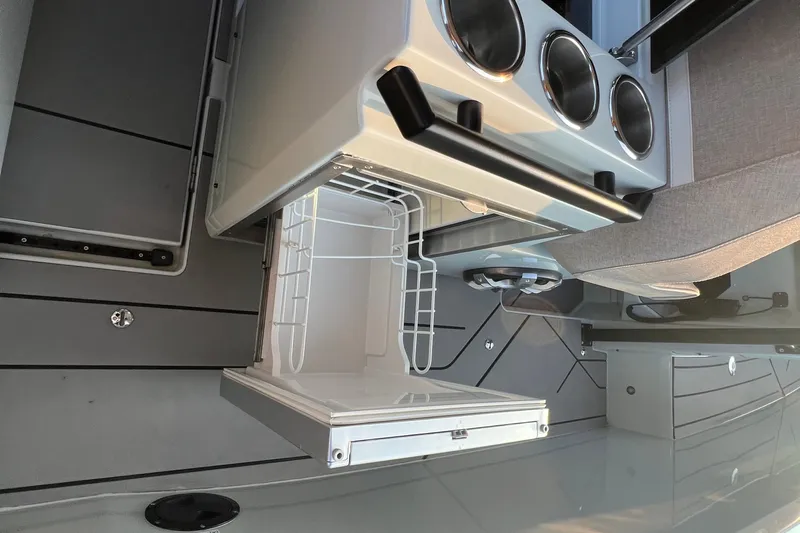  Yacht Photos Pics 2023 Saxdor 320 GTO interior with open storage compartment and modern design.