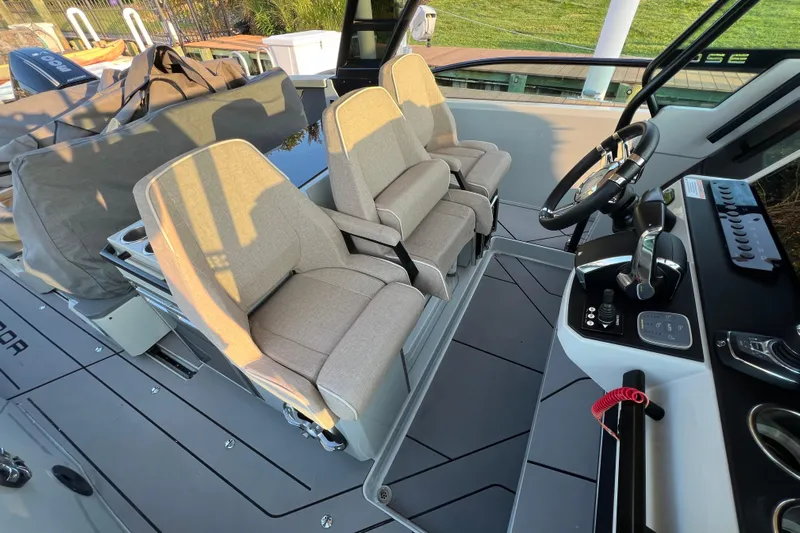  Yacht Photos Pics Interior of 2023 Saxdor 320 GTO boat with modern seating and control panel.