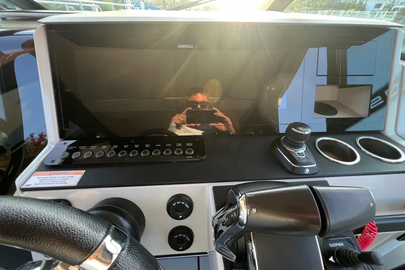  Yacht Photos Pics 2023 Saxdor 320 GTO dashboard with Simrad display and control panel.