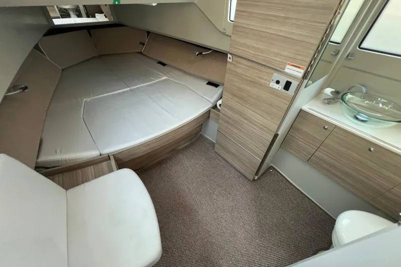  Yacht Photos Pics 2023 Saxdor 320 GTO cabin interior with bed, sink, and modern wood finish.
