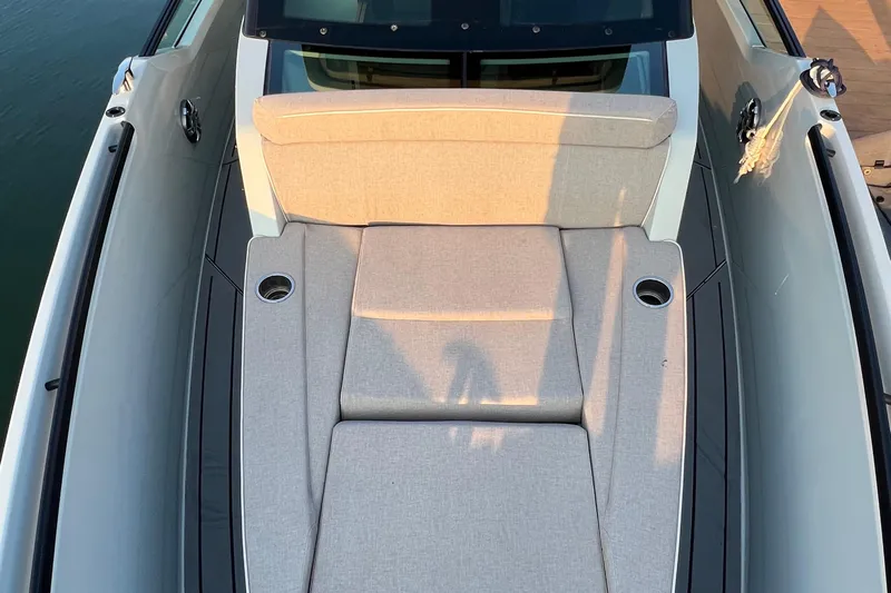 Yacht Photos Pics 2023 Saxdor 320 GTO boat with beige cushioned seating and cup holders on deck.