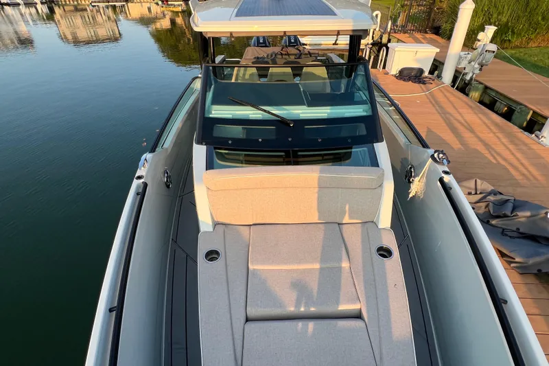  Yacht Photos Pics 2023 Saxdor 320 GTO boat docked, featuring sleek design and comfortable seating.