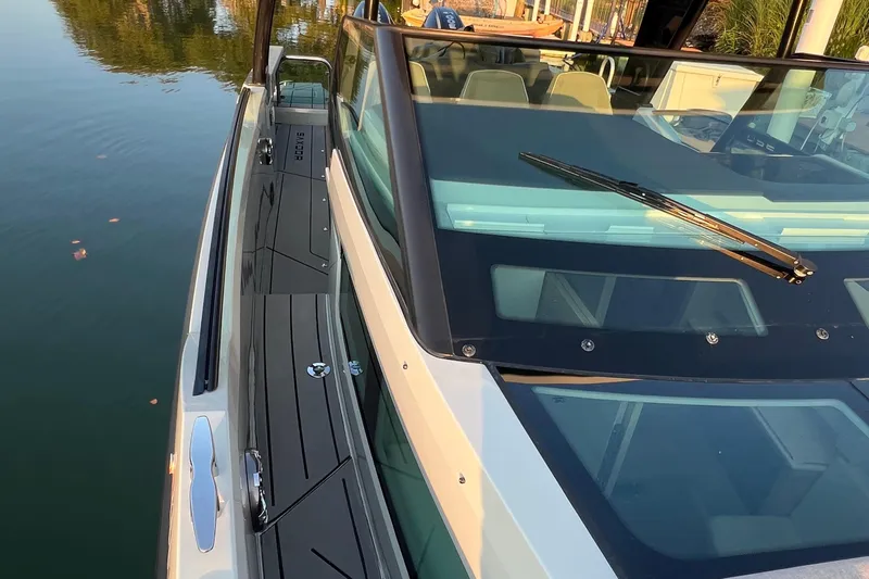  Yacht Photos Pics 2023 Saxdor 320 GTO boat, sleek design, docked on calm water, close-up view.