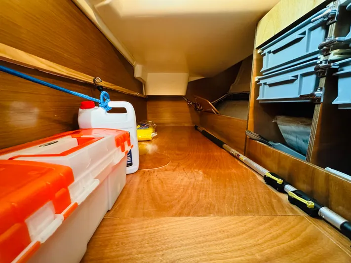 La Dauphine Yacht Photos Pics Storage compartment in 2007 Jeanneau Sun Odyssey 36i sailboat with tools and equipment.