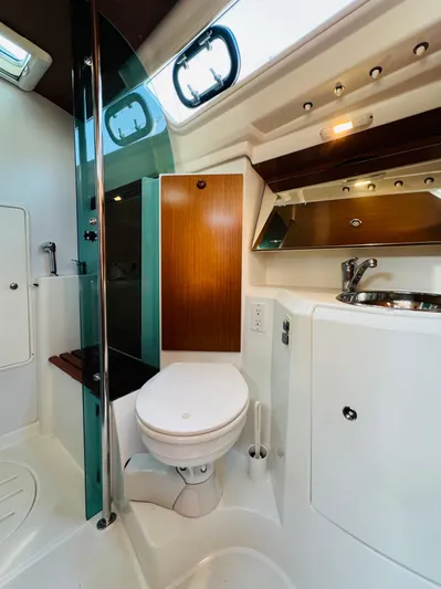 La Dauphine Yacht Photos Pics 2007 Jeanneau Sun Odyssey 36i yacht bathroom with modern fixtures and wood accents.