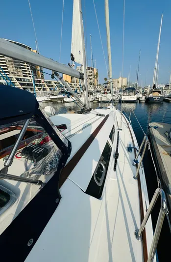 La Dauphine Yacht Photos Pics 2007 Jeanneau Sun Odyssey 36i sailboat docked in marina, clear blue sky.